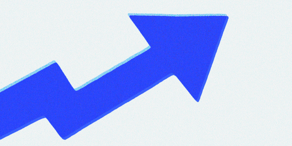 A blue arrow pointing up on a white background. The arrow represents growth, progress, or success. 